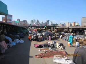 The traditional healer market below the modern city